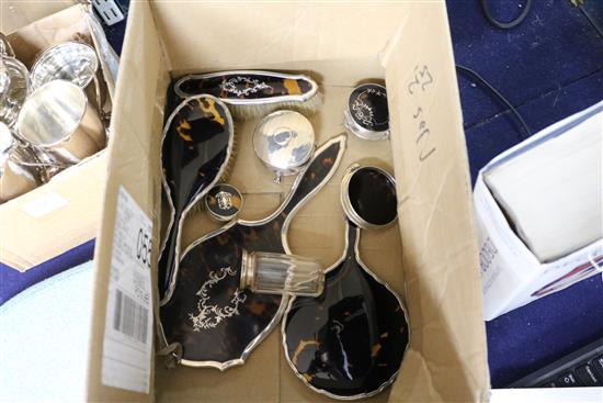 A silver and tortoiseshell harlequin dressing table set with related jars, dishes, etc.